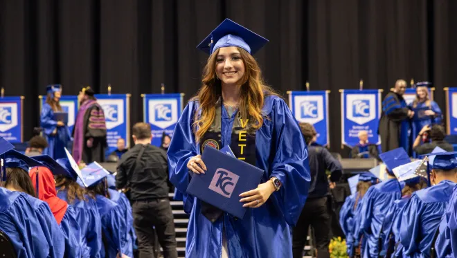 Student holds diploma
